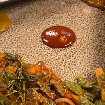 Enat Ethiopian Restaurant - Meat Platter over Injera - Ethiopian Near Me - Charlotte, North Carolina Enat Ethiopian Restaurant - Meat Platter over Injera - Ethiopian Near Me - Charlotte, North Carolina