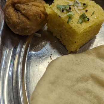 Rajdhani Thali Restaurant - From top - That pea snack, Dhokla and Papad - Indian Near Me - Issaquah, Washington