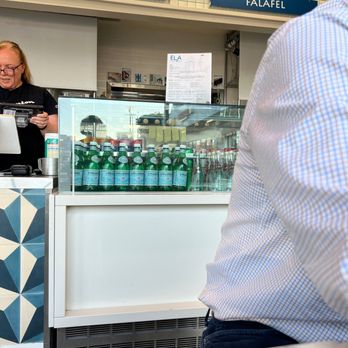 Ela Greek Eats - a woman behind a counter - Greek Near Me - Venice, California Ela Greek Eats - a woman behind a counter - Greek Near Me - Venice, California