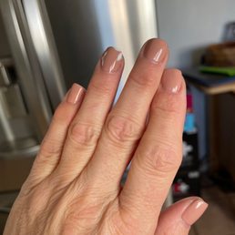 Gel manicure with delicate flowers on ring fingers.