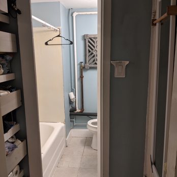 E&L Cabinets - Our old bathroom before the renovations had broken tiles & a floor that was sinking. They replaced the whole floor structure to shore it up - Cabinetry Near Me - Marlborough, Massachusetts