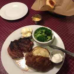 Hibbett Sports - Bacon wrapped filet mignon medium rare baked potato steamed broccoli for dinner at the Lone Star steakhouse in Mt Vernon Il looks so good