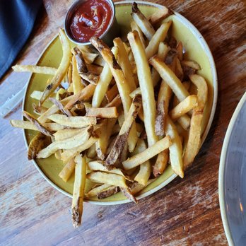 Top Hat - House fries served with the most delicious catchup, perfectly spiced with a bit of kick. - Bars Near Me - Missoula, Montana