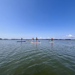 Eagle's Neck Paddling Co - Paddle Boarders enjoying the calm water
