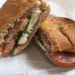 Prosciutto sandwich with fresh mozarella, tomatoes, basil and balzamic vinegratte Prosciutto sandwich with fresh mozarella, tomatoes, basil and balzamic vinegratte