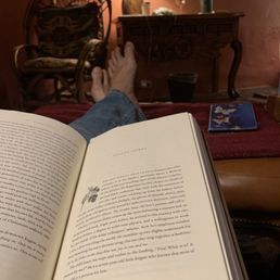 Reading in our Rosa room by the fire. Divine small inn with fab service.