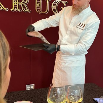 Restaurant Guy Savoy - Chef sharing catch before fillet. - French Near Me - Las Vegas, Nevada Restaurant Guy Savoy - Chef sharing catch before fillet. - French Near Me - Las Vegas, Nevada