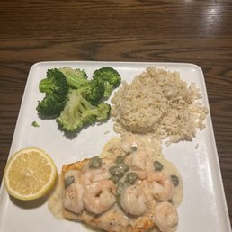 Salmon topped with shrimp.
