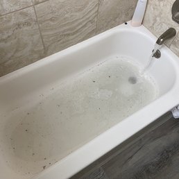 My supposedly "cleared pipe" with standing water in the tub... My supposedly "cleared pipe" with standing water in the tub...