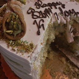 Custom pistachio birthday cake with pistachio cannolis Custom pistachio birthday cake with pistachio cannolis