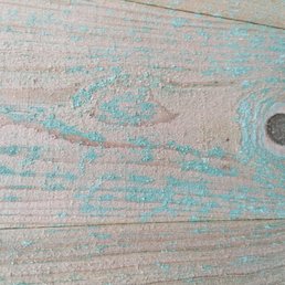 They claim this is some chemical the wood is shipped in, but they still should have washed it off.