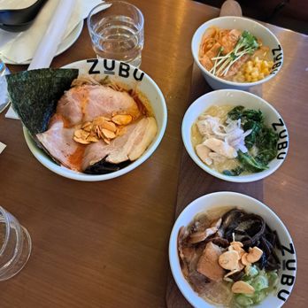 ZUBU - Left: mini spicy tonkotsu ramen. Right: Ramen flight (spicy vegan, creamy chicken, and Tonkotsu broth from top to bottom) - Ramen Near Me - Vancouver, British Columbia