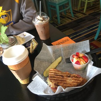 Mug Shotz Cafe - White chocolate mocha and half sandwich of Ruben, pickle, and cup of fruit - Coffee & Tea Near Me - Ahoskie, North Carolina Mug Shotz Cafe - White chocolate mocha and half sandwich of Ruben, pickle, and cup of fruit - Coffee & Tea Near Me - Ahoskie, North Carolina
