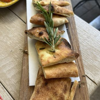 Gaby Cucina - Focaccia bread, which they charge $7.00 for and didn't mention that when they asked if we'd like bread. - Italian Near Me - Aventura, Florida Gaby Cucina - Focaccia bread, which they charge $7.00 for and didn't mention that when they asked if we'd like bread. - Italian Near Me - Aventura, Florida