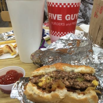 Five Guys - The white cup is the large fries! Enough to share with a couple ppl but too much salt in em! - Burgers Near Me - Las Vegas, Nevada