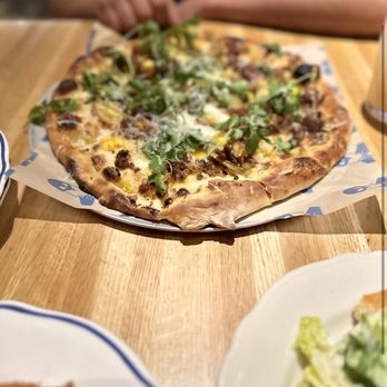 Doughbird - a pizza on a wooden table - Pizza Near Me - Phoenix, Arizona