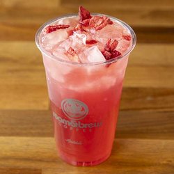 Roam & Brew Coffee - Hibiscus & berries tea, strawberry, lemonade, water, and garnished with freeze dried strawberries.