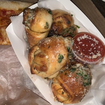 Pizza by Lucilles - Puffy Garlic bread with Parmesan sprinkled on top marinera sauce on the side - Pizza Near Me - New York, New York