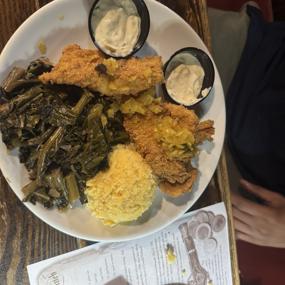 The Pirates’ House - Southern Style Catfish with collard greens and grits - Southern Near Me - Savannah, Georgia The Pirates’ House - Southern Style Catfish with collard greens and grits - Southern Near Me - Savannah, Georgia