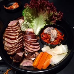 Dae Jang Kum - Pork leg, wrap with veggies and side dishes.