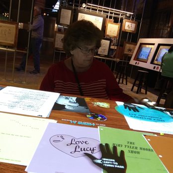 National Comedy Center Museum - There are 2 tables.  It has a sheet from a script and the clip. You can see ad-libs. The hand is where you swipe to start - Museums Near Me - Jamestown, New York