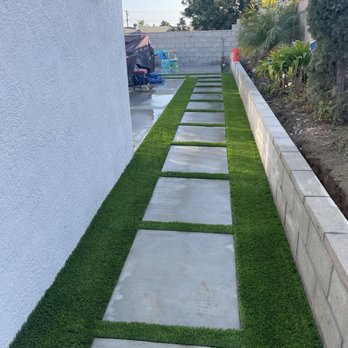 American Turf Depot - a walkway with artificial grass - Landscaping Near Me - Stanton, California