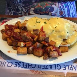 Under the eggs is the corned beef hash Under the eggs is the corned beef hash