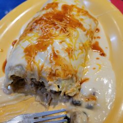Fuzzy's Taco Shop - Disgusting salt cheese bs soaked sorry excuse for a burrito stuffed with unseasoned crap.
