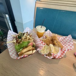 Fish sandwich with tsunami fries, fish and chips  and orange bang