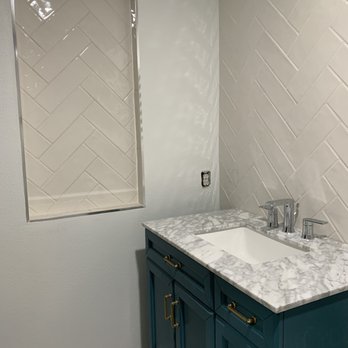 New Impressions Tile - a bathroom with marble counter tops - Cabinetry Near Me - Bloomington, California New Impressions Tile - a bathroom with marble counter tops - Cabinetry Near Me - Bloomington, California