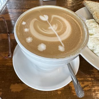 Trummer's Coffee & Wine Bar - Latte..... love love love the artwork - Wine Bars Near Me - Gainesville, Virginia