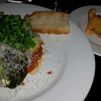 112 Eatery - Spinach and Ricotta Voltini ($22) with some bread and shrimp to the right. - New American Near Me - Minneapolis, Minnesota
