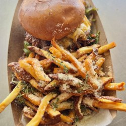 Simmer Down Food Truck - 100% Angus beef, American cheese, onions, mixed greens, tomato, pickles, not-so-secret sauce, brioche bun. (upgrade to Truffle Fries)