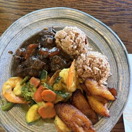 I loved combo coconut curry shrimp, oxtails, plantains and rice. I loved combo coconut curry shrimp, oxtails, plantains and rice.