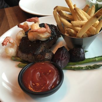 Chop Steakhouse & Bar - Smokey ribeye with garlic shrimp and fries - Steakhouses Near Me - Vancouver, British Columbia