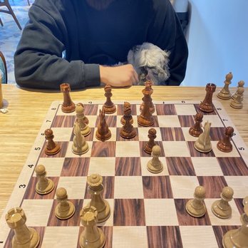 Game N Grounds - Husband and I playing chess while drinking dirty chai's. - Coffee & Tea Near Me - Los Angeles, California