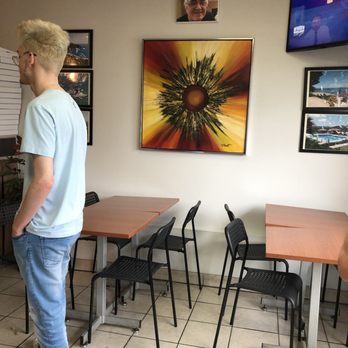 Corfu Pizzeria - A couple of tables in front of the pay counter - Pizza Near Me - Terrebonne, Quebec Corfu Pizzeria - A couple of tables in front of the pay counter - Pizza Near Me - Terrebonne, Quebec