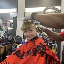 Cut N Up Barbershop - Mr George got him to smile