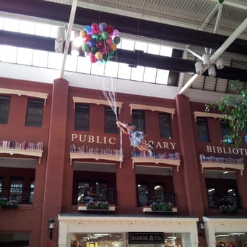 Market Square - Floating girl attached to balloons. - Shopping Centers Near Me - Saint John, New Brunswick