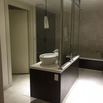 Kimpton EPIC Hotel - Bathroom in 1 bedroom suite with rainfall shower (this is actually a really cold way to shower- brr) - Hotels Near Me - Miami, Florida Kimpton EPIC Hotel - Bathroom in 1 bedroom suite with rainfall shower (this is actually a really cold way to shower- brr) - Hotels Near Me - Miami, Florida