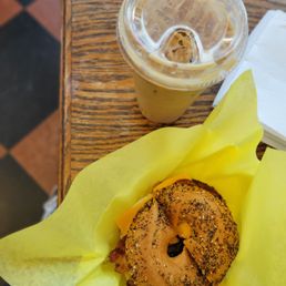 a bagel and coffee on a table