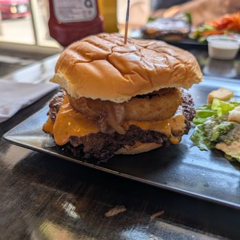 The Works - Double smash patty with an onion ring, burger sauce, and a spicy relish. Would reorder. - Burgers Near Me - Niagara Falls, Ontario The Works - Double smash patty with an onion ring, burger sauce, and a spicy relish. Would reorder. - Burgers Near Me - Niagara Falls, Ontario