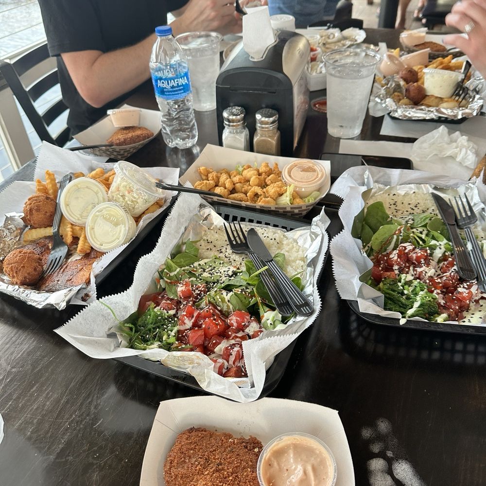 Dockside Seafood Restaurant - Left to right, cobia, gator bites, crab cake, poke - Seafood Near Me - Jacksonville Beach, Florida Dockside Seafood Restaurant - Left to right, cobia, gator bites, crab cake, poke - Seafood Near Me - Jacksonville Beach, Florida