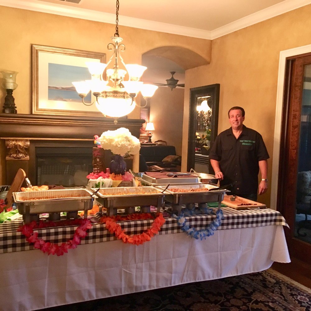 T Bone's BBQ Catering - Tracy at our food table - Caterers Near Me T Bone's BBQ Catering - Tracy at our food table - Caterers Near Me