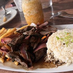 Lomo Salteado, with white rice and fries Lomo Salteado, with white rice and fries