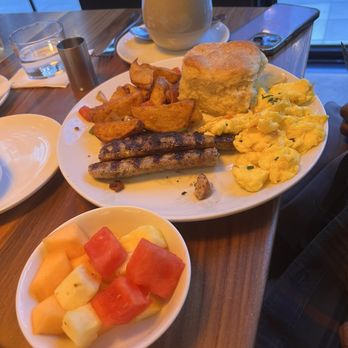 Saints + Council - All Saints Breakfast with fruit, biscuit, chicken sausage, eggs, and skillet potatoes - Breakfast & Brunch Near Me - Atlanta, Georgia Saints + Council - All Saints Breakfast with fruit, biscuit, chicken sausage, eggs, and skillet potatoes - Breakfast & Brunch Near Me - Atlanta, Georgia