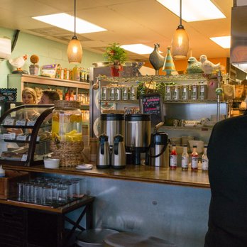 Juicy Kitchen - The register, pastry display, counter seating, and friendly staff. - Breakfast & Brunch Near Me - Ann Arbor, Michigan