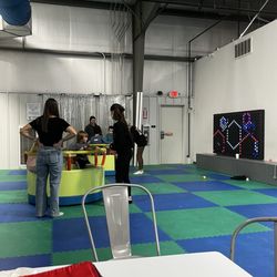 Breakaway Indoor Playground - Light wall and merry go rounds.