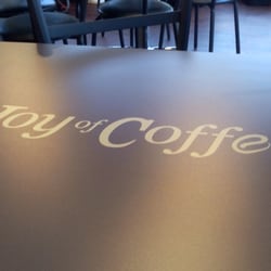 The Joy of Coffee - Fancy monogrammed tables. Very nice atmosphere.