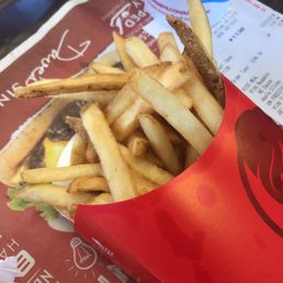 french fries and a drink on a tray